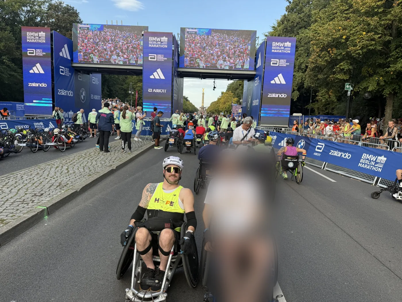 Thomas at the Berlin Marathon start area, another racer blurred beside him